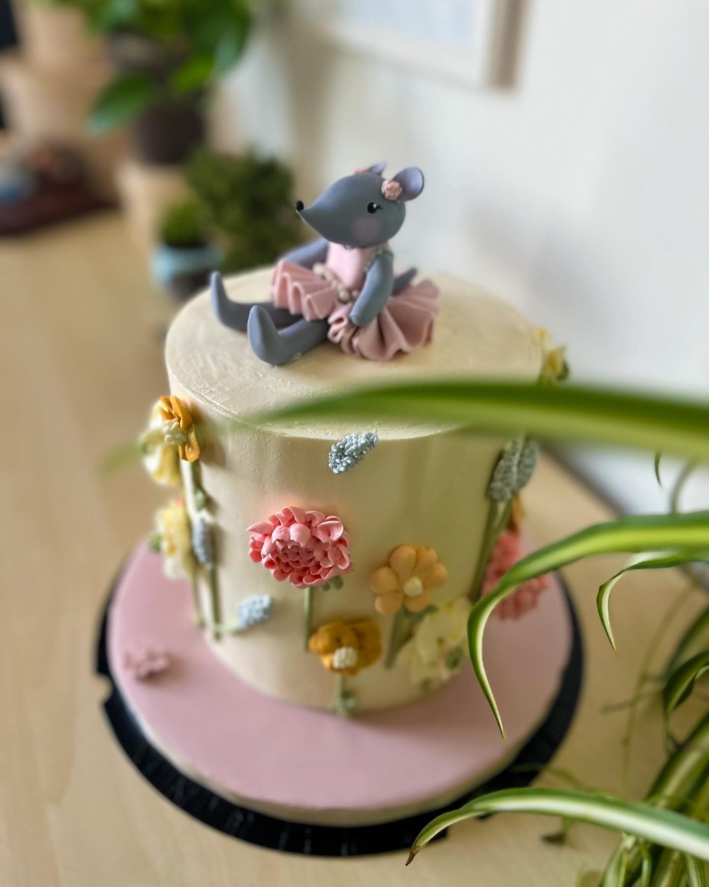 Buttercream meadow cake with sugar mouse ballerina